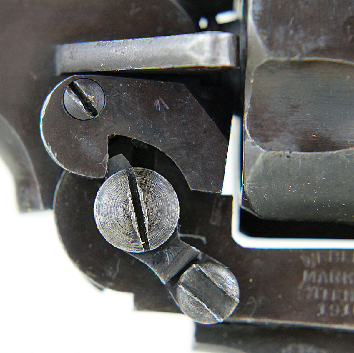 External parts and screws barnacle the Webley. These three screws are associated with pivoting the top-break barrel and operating the automatic ejector.